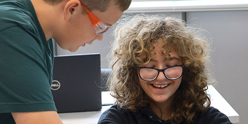 Students smiling in classroom