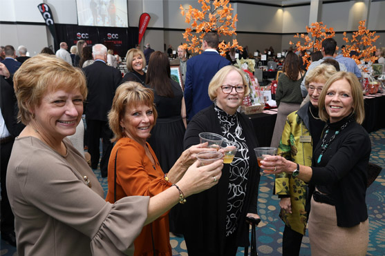 Several women smiling with drinks at Great Tastes event