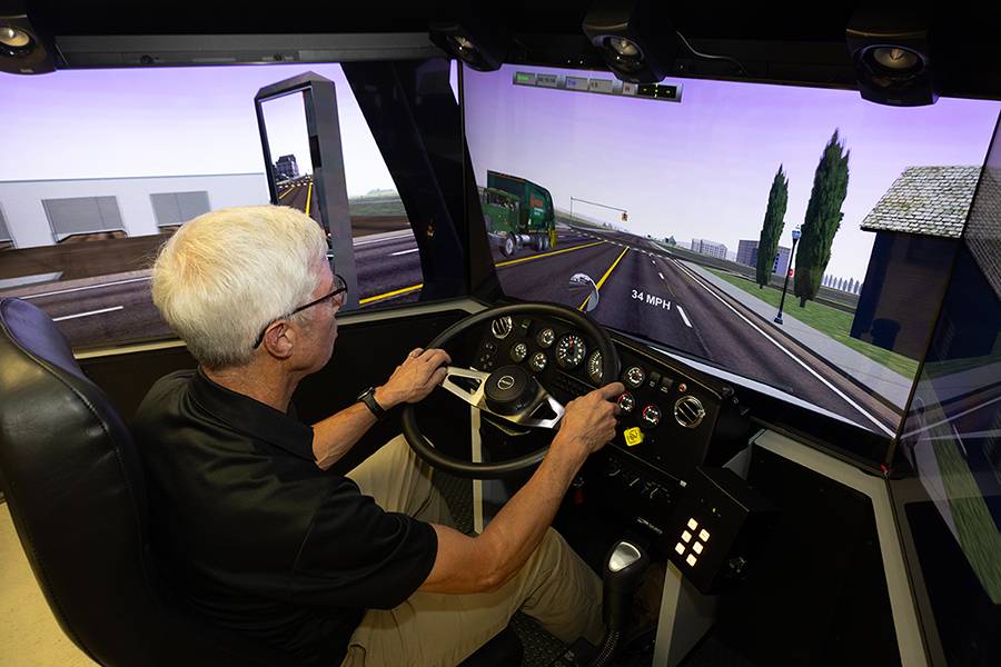 Instructor using truck driving simulator